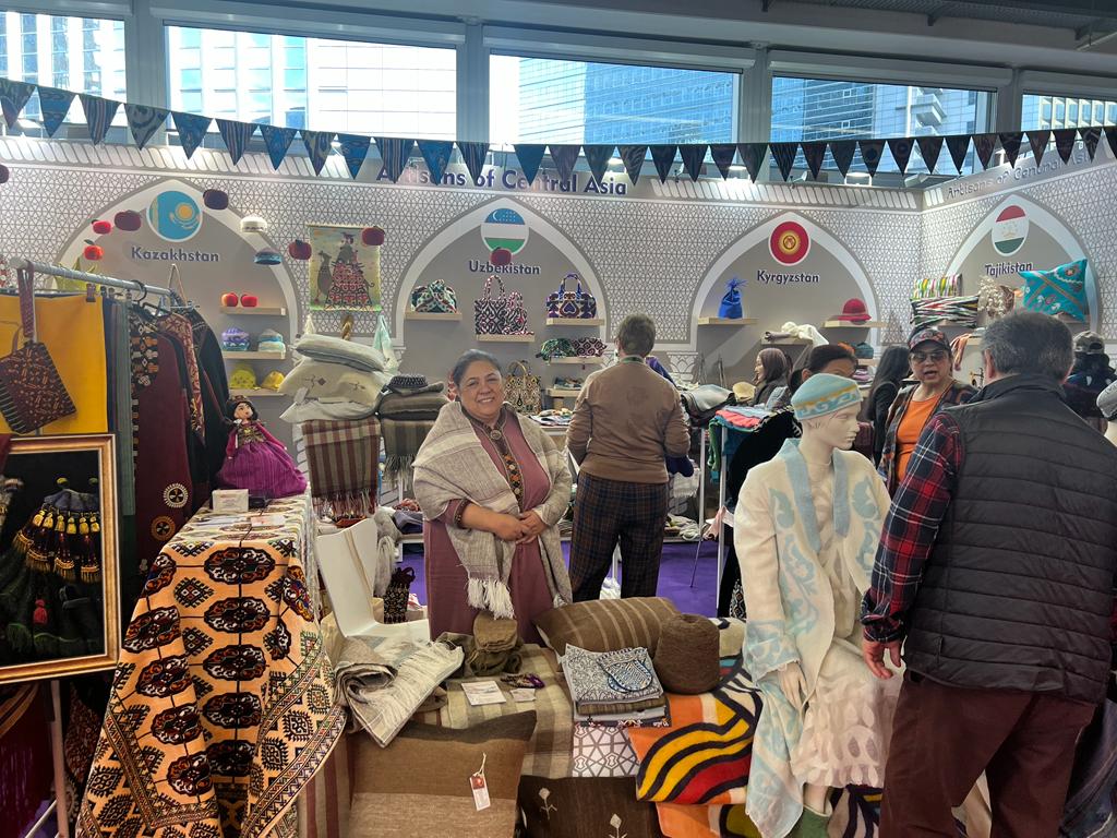 Artisan from Turkmenistan stands at the Central Asia Creativeworld 2023 booth