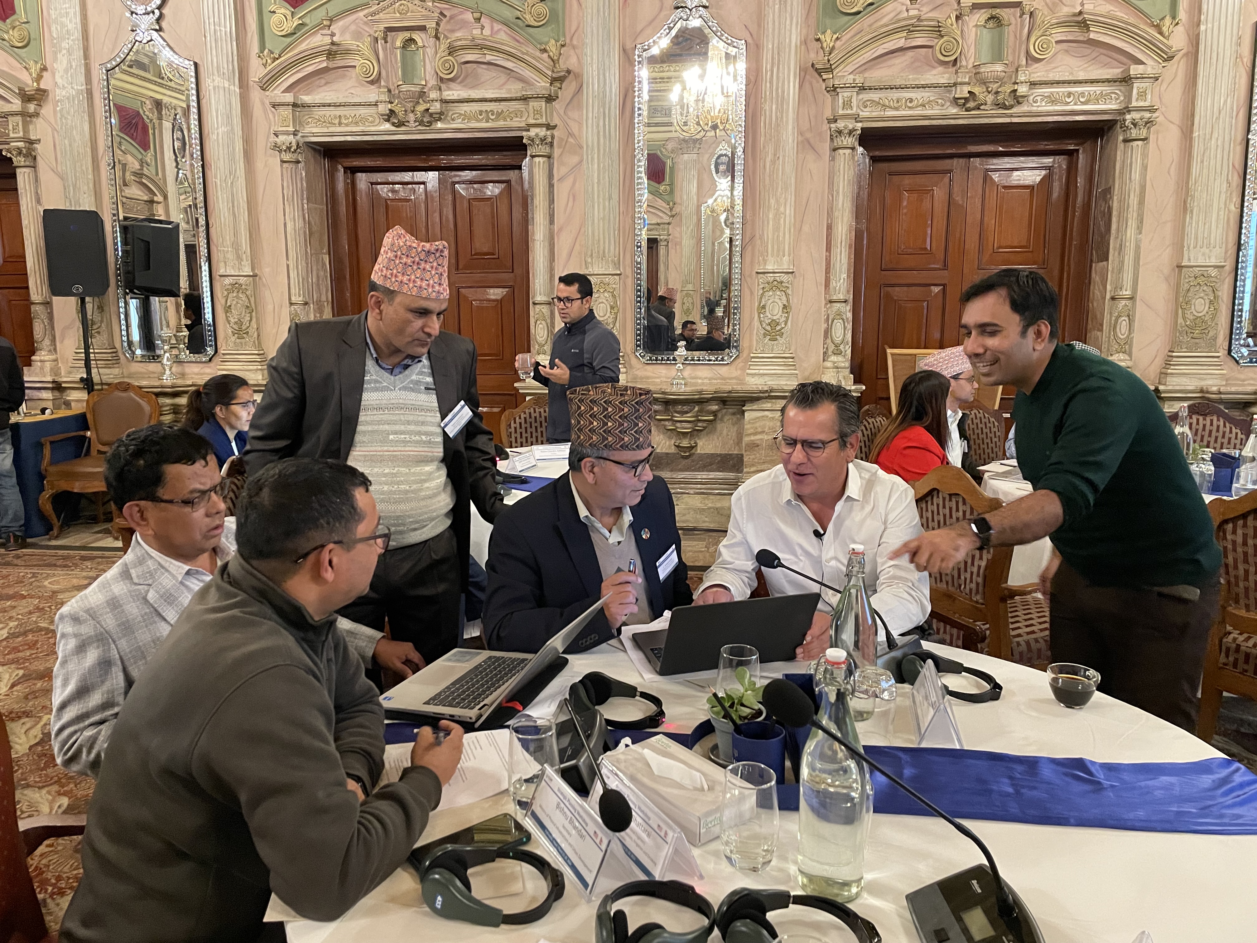 Participants converse while sitting at table