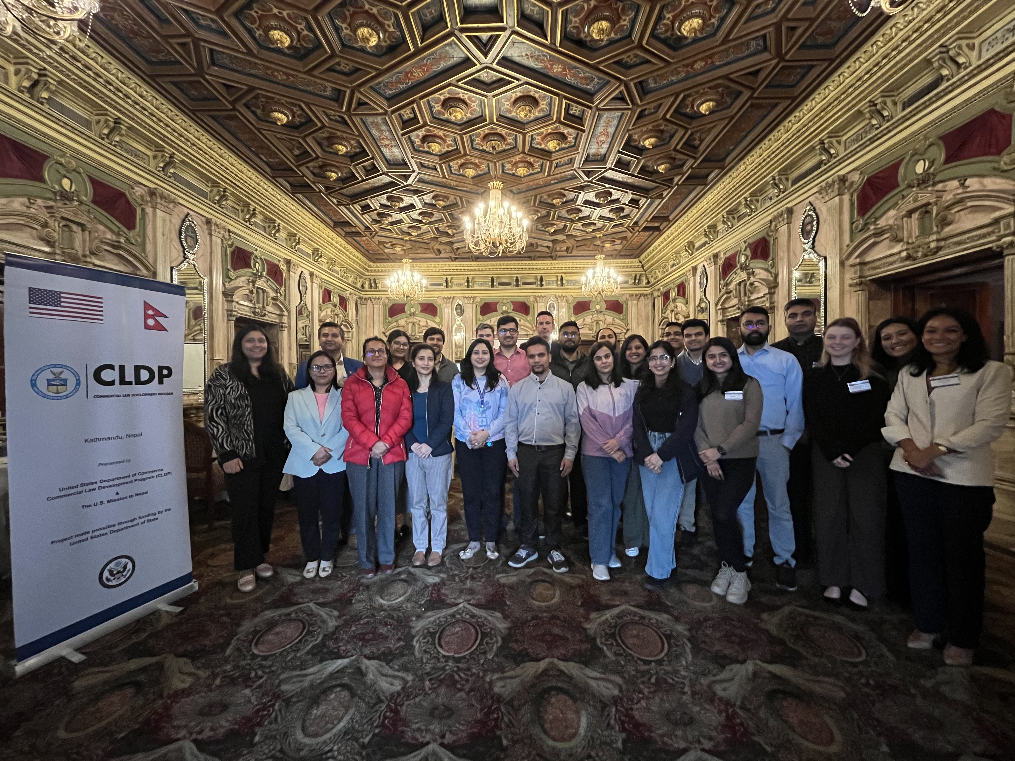 Large group of people standing in front of a CLDP banner