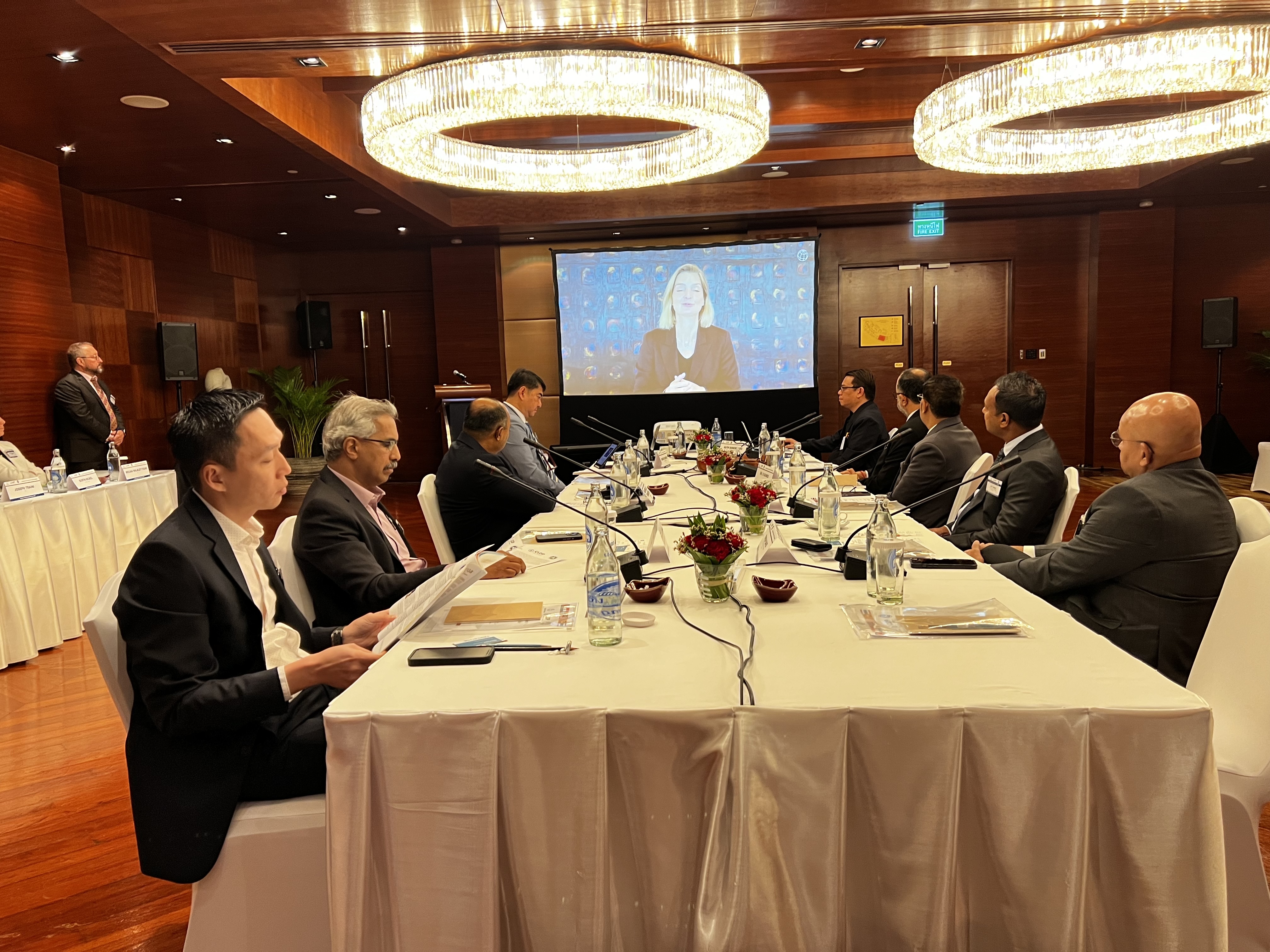 Photo of South Asia Ports CEO Authorities sitting at boardroom-style table, while a presentation is playing in the background