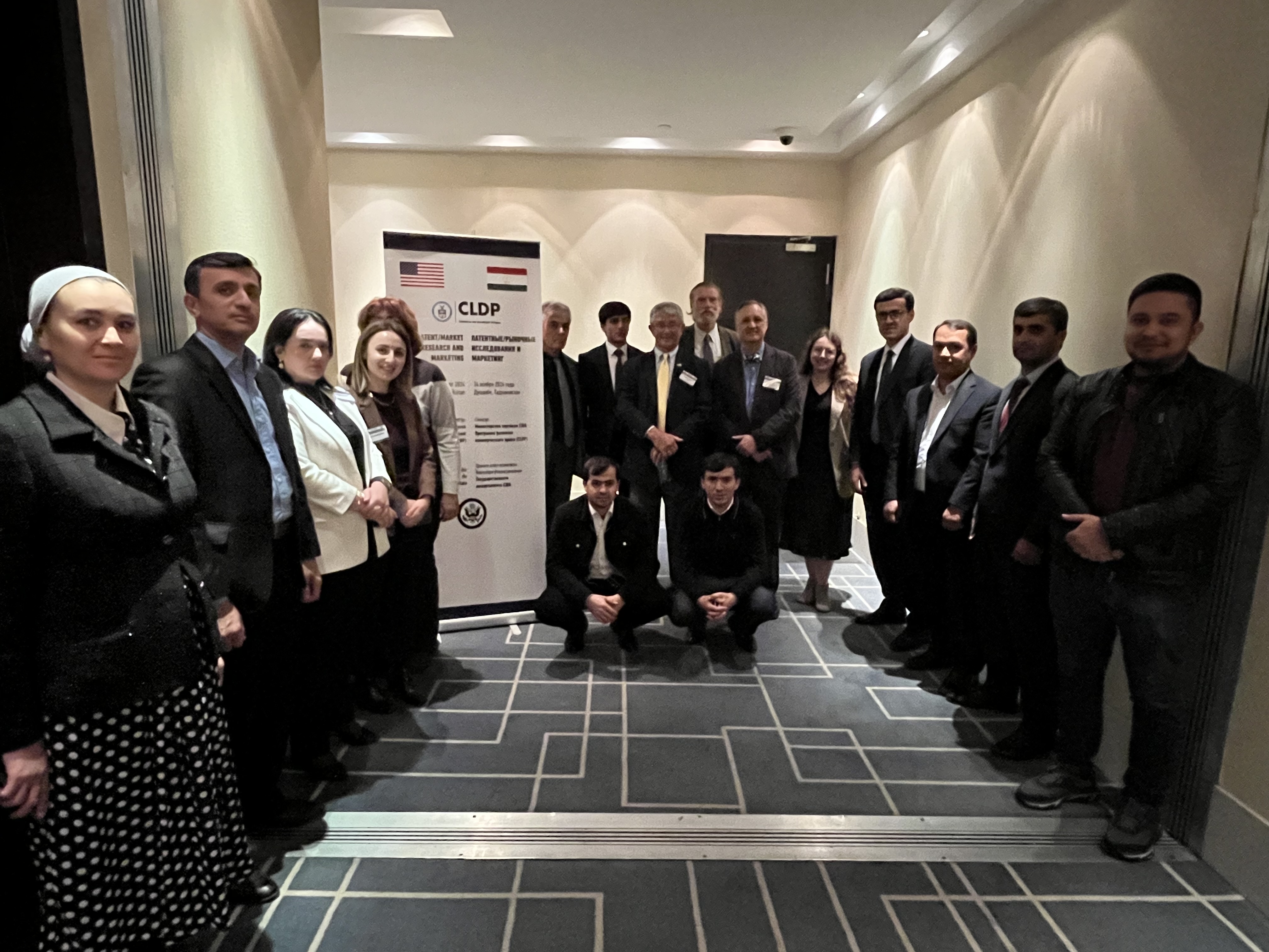 Group photo in front of sign