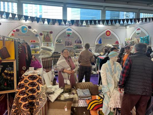 Artisan from Turkmenistan stands at the Central Asia Creativeworld 2023 booth